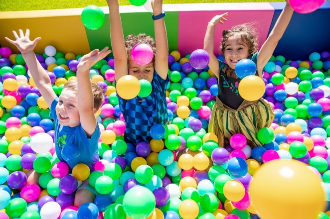 young kids in a ball pit at a birthday party