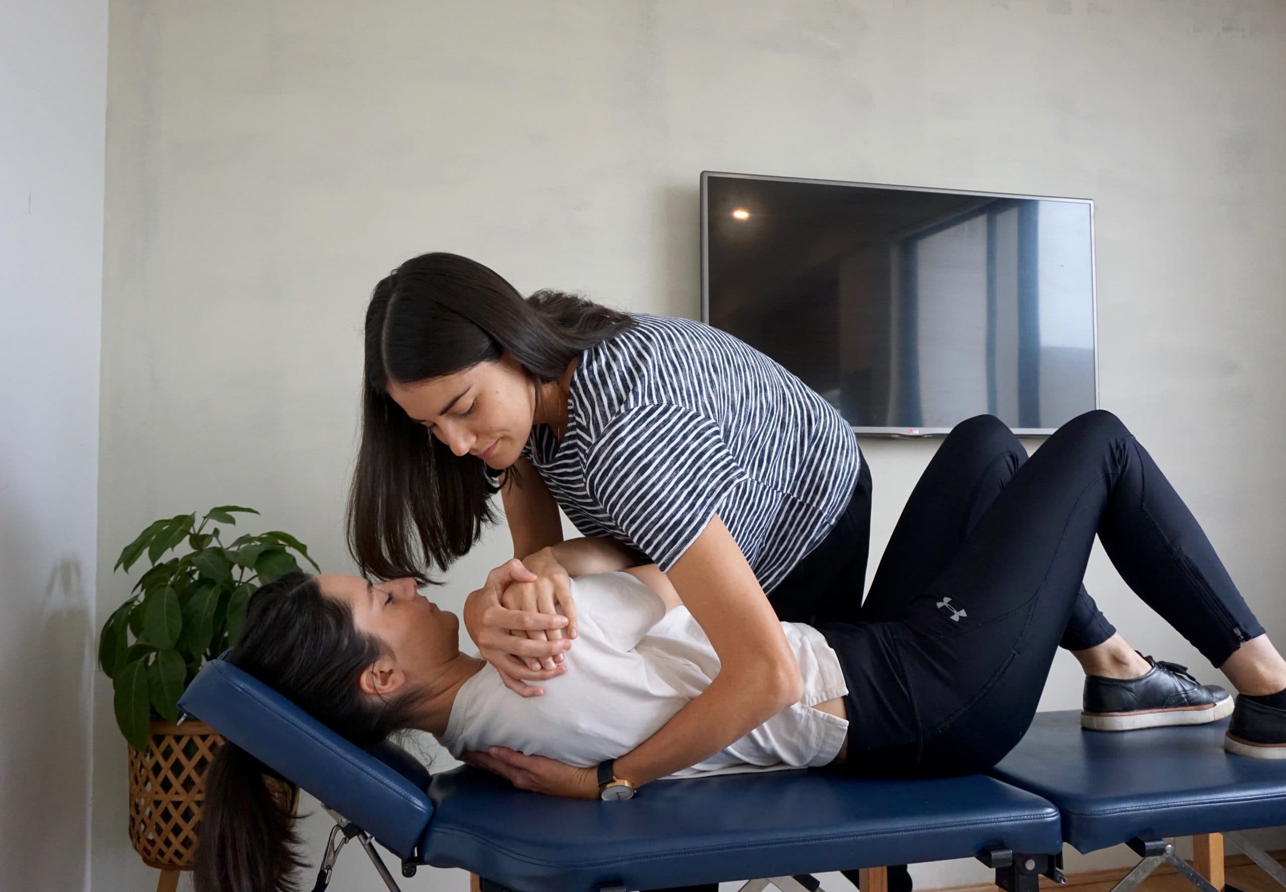Dr. Nicole (Chiropractor) performing an Upper Back Manipulation