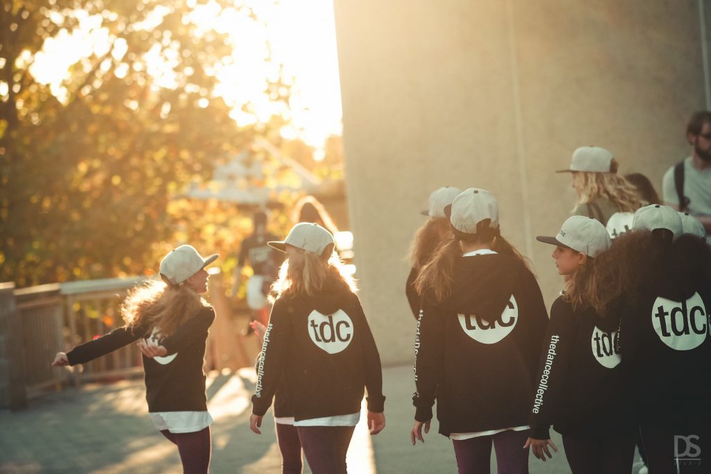 Girls in The Dance Collective Hoodies in Willagee walking outside the dance studio