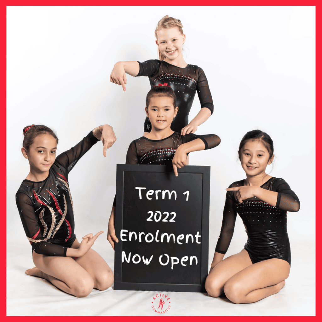 4 young dancers from Active Gymnastics pointing to a sign that reads term 1 2022 enrollment