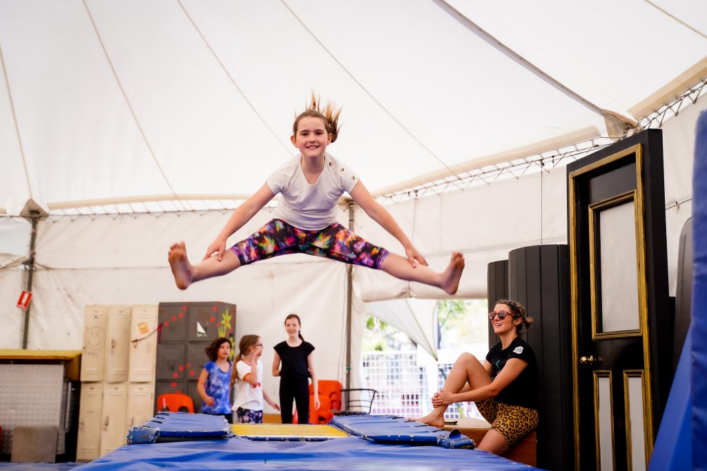 Young girl jumping on a mat during classes at Circus WA in Fremantle
