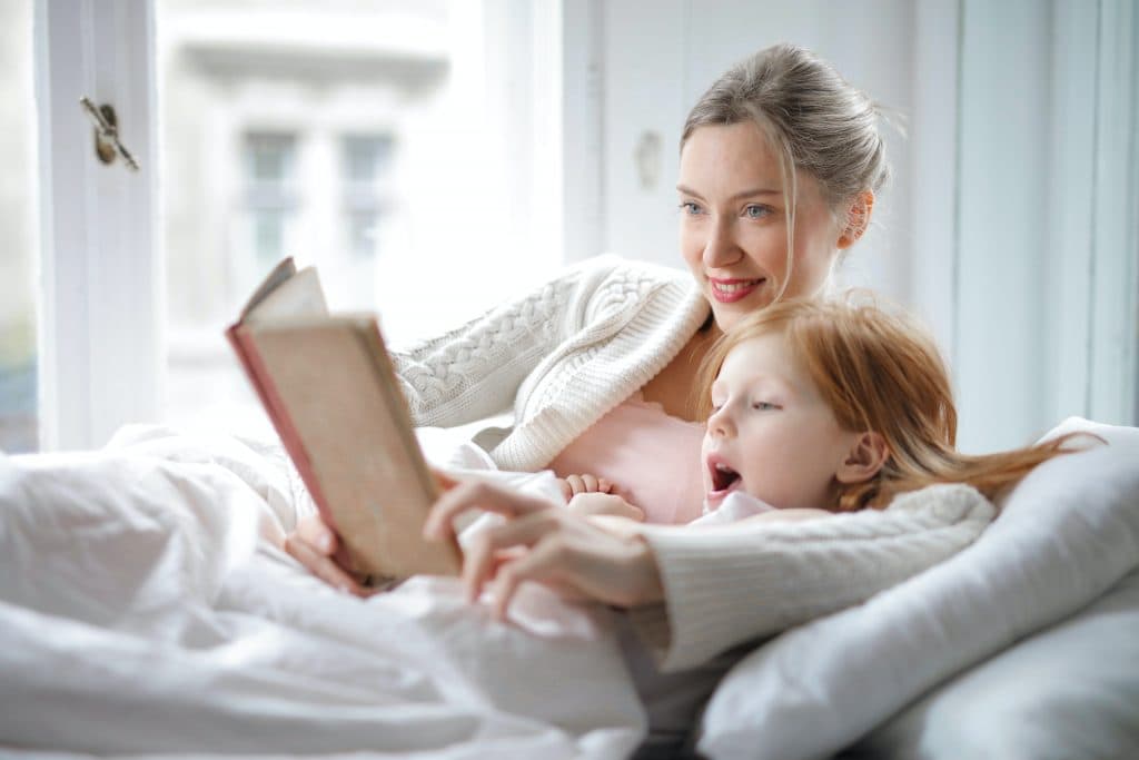 family tradition of mum reading a book to her daughter every night