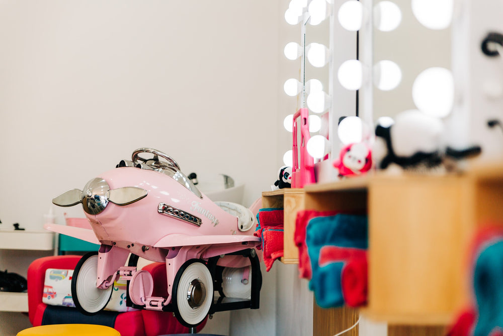kids hairdresser pink plane salon chair around Melville 